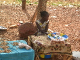 A young peanut saleswoman