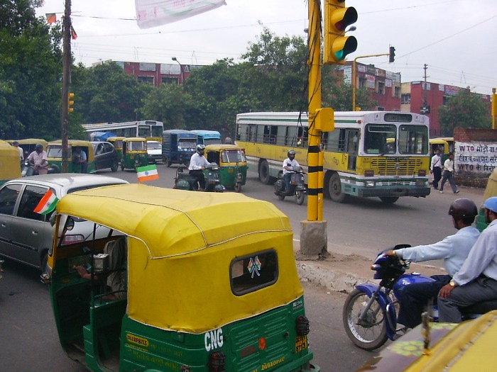 Rickshaws and a bus