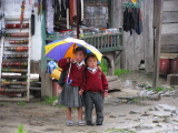 Two young children in the rain